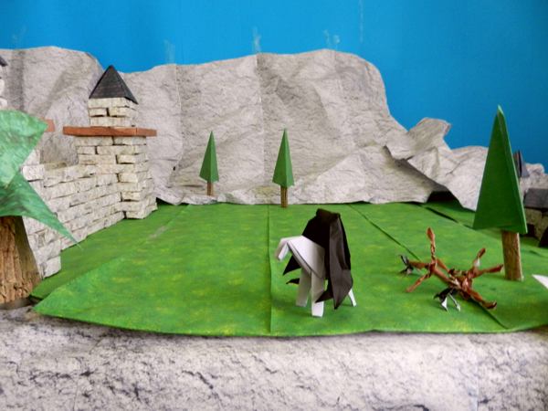 origami headless horseman at a large castle