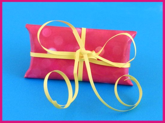pink origami gift box with yellow papercraft ribbon