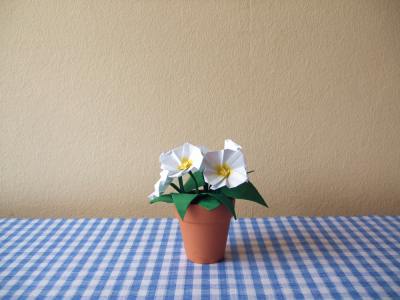arrangement of origami primroses in a little pot