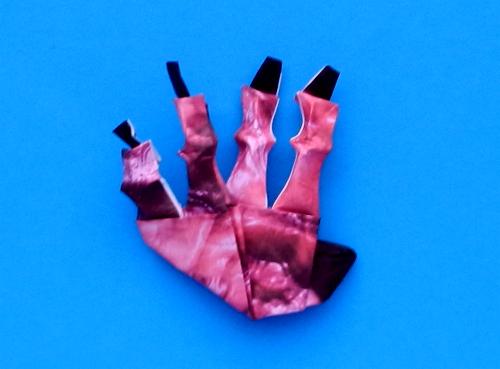 origami bloody hand with black nails
