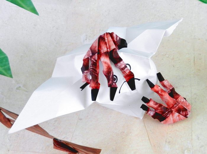origami bloody hands holding a ghost