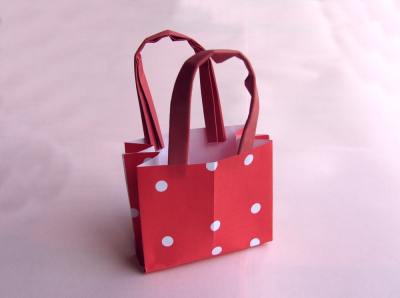 red kirigami shopping bag