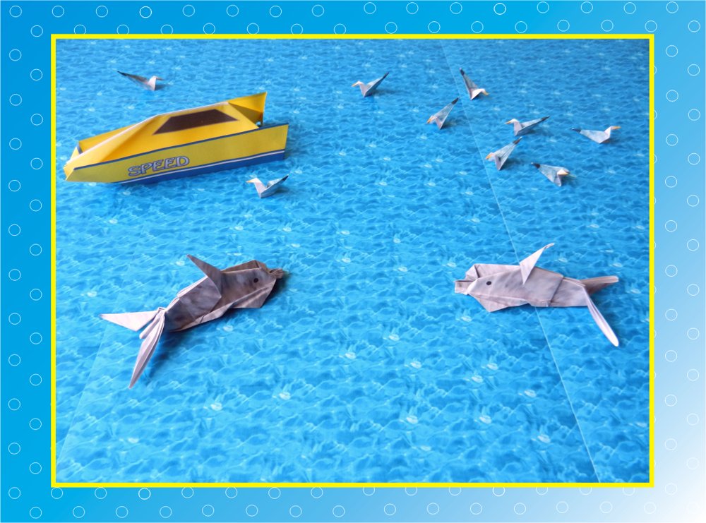 card with cute origami dolphins in the ocean