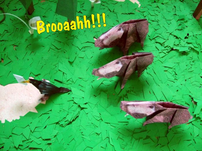 wild paper boars scaring of an origami bird