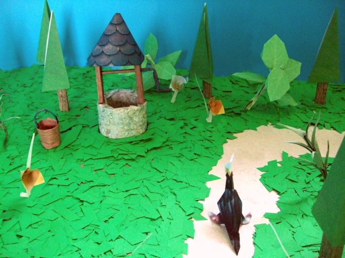 kirigami well in a forest made of paper