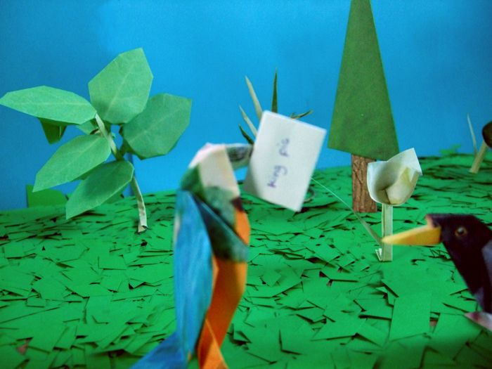 origami parrot with a letter in his mouth