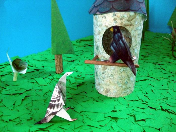 origami bird in a paper birdhouse