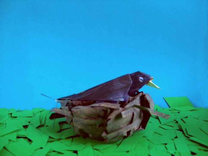 origami bird sleeping in his nest