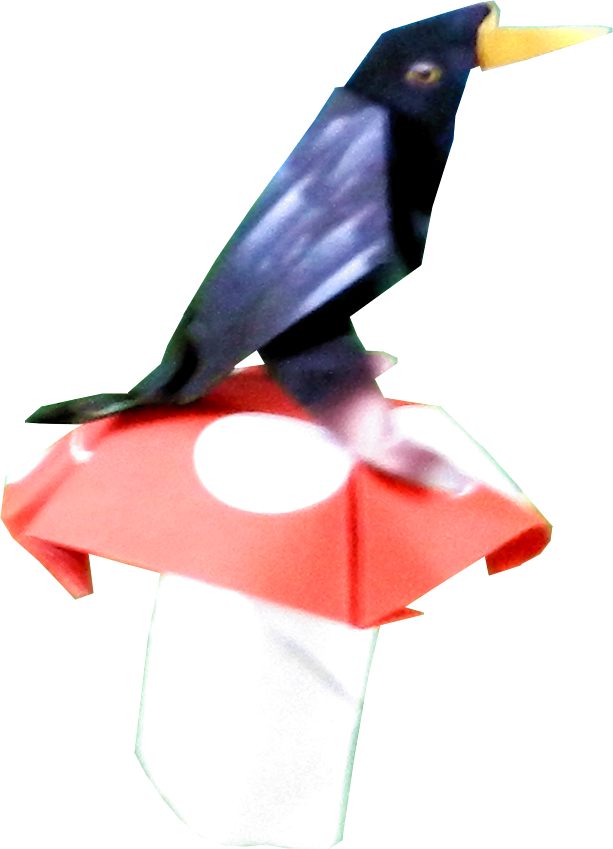 origami bird on a big red and white mushroom
