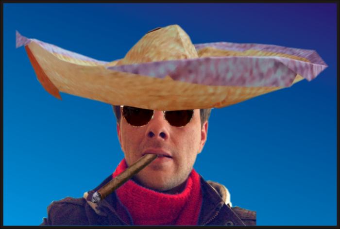 man with sunglasses and origami sombrero