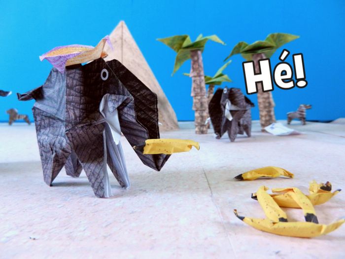 origami elephant eating bananas in the desert