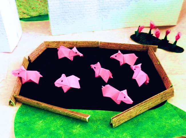 Pink origami piglets