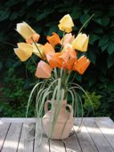 Origami tulips in a stone vase