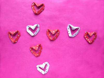 red and white polka dot patterned origami hearts