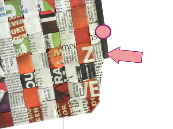 Make a woven newspaper clutch purse