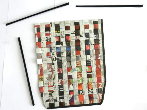 Make a woven newspaper clutch purse