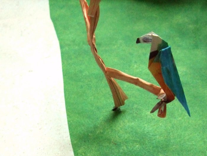 origami parrot in a paper tree