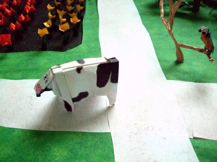 funky origami cow in the land