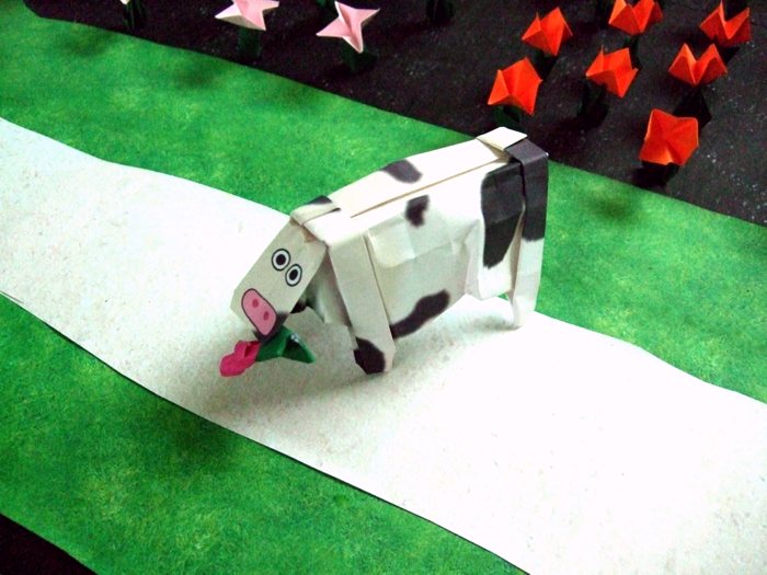 origami cow eating a flower