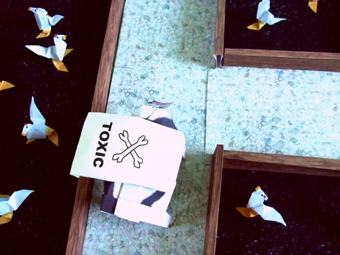 cow walking at an origami chicken farm