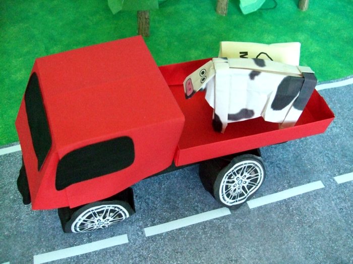 kirigami pick up truck riding on the road