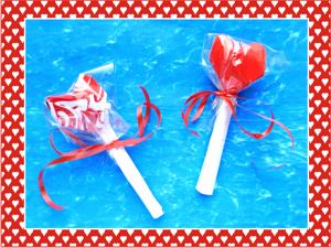 Valentine origami card with heart shaped lollipops