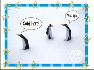 Card with funny origami penguins in real snow