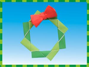 Christmascard of an origami wreath with red bow