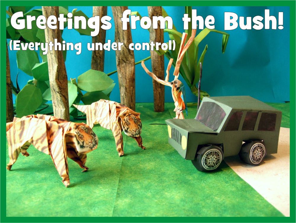 free card with origami tigers in front of a kirigami jeep