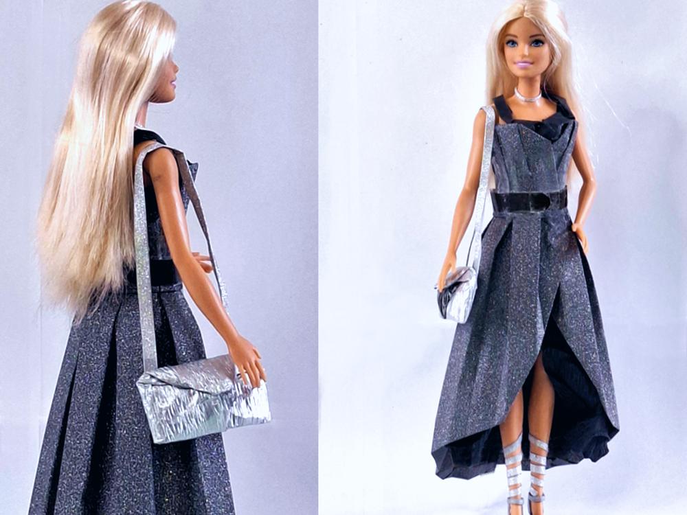 Barbie doll in a paper party dress