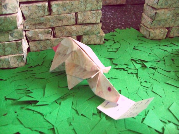 funny origami rat reading a letter