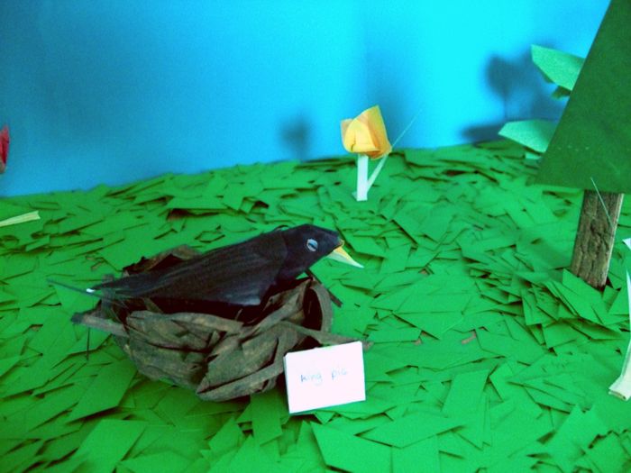 cute origami bird sleeping in a nest