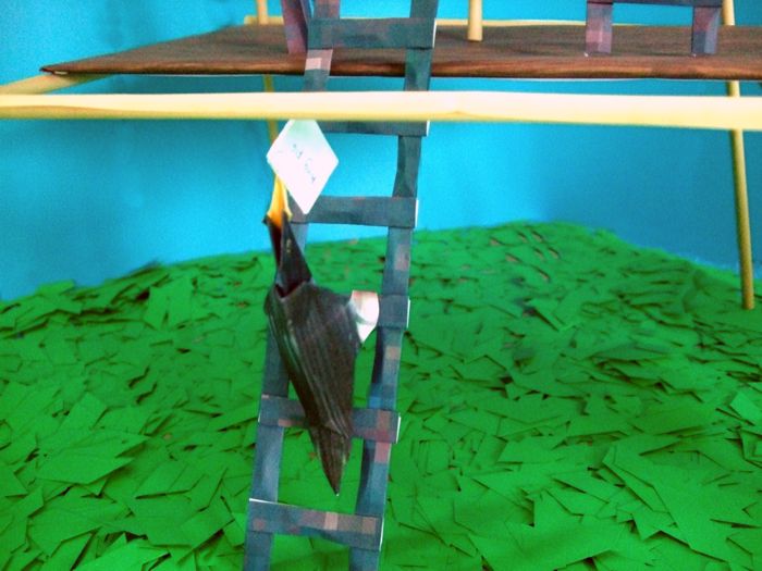 bird climbing a kirigami tower