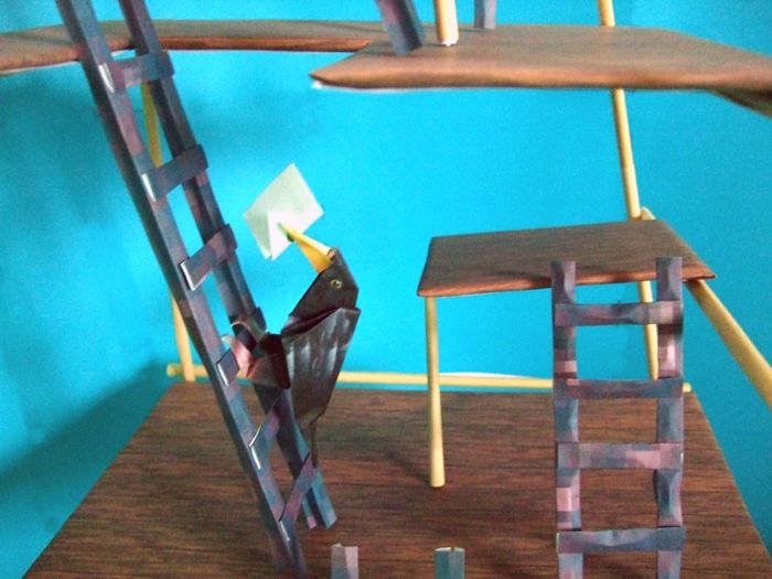 bird climbing a kirigami ladder