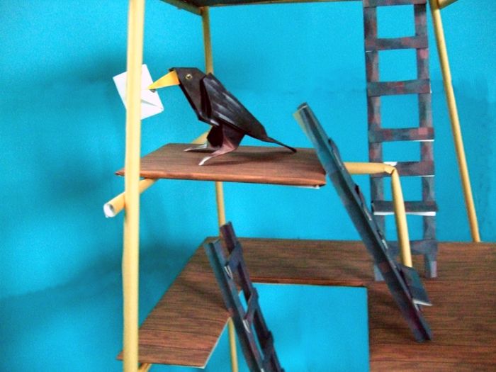 funny bird on a kirigami tower