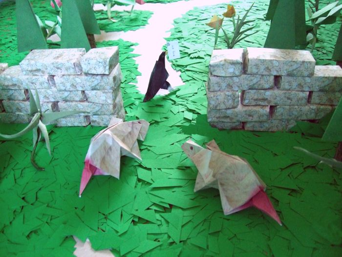 origami rats and a bird running away