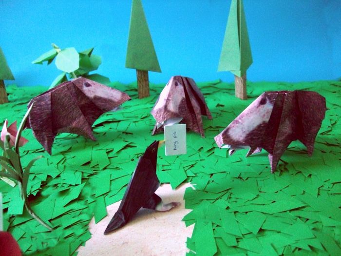 origami boars in a large forest