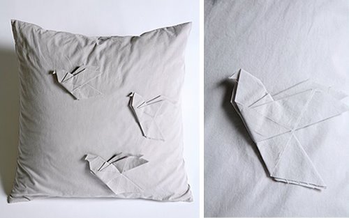 Cushion with origami details