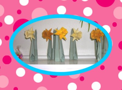 cute origami daffodils on a pink polka dot background