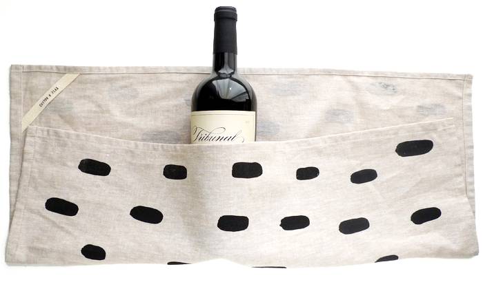 Wine bottle wrapped in a tea towel