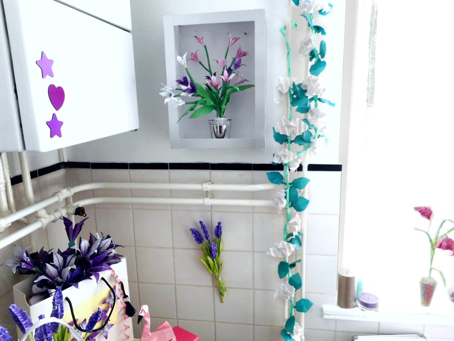 Origami flowers in a bathroom