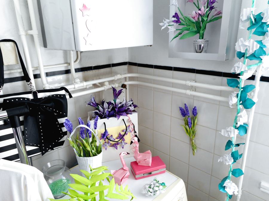 Origami flowers in a bathroom