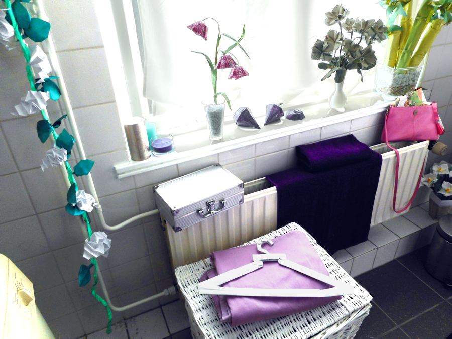 Origami flowers in a bathroom