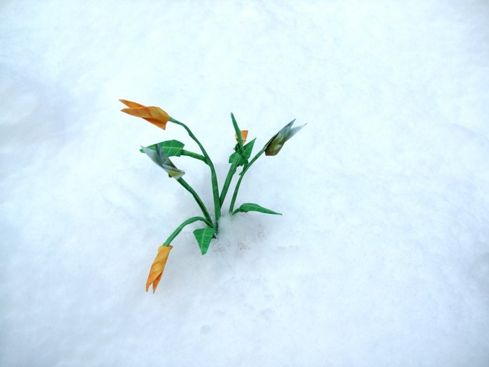 origami paper flowers outside in real snow