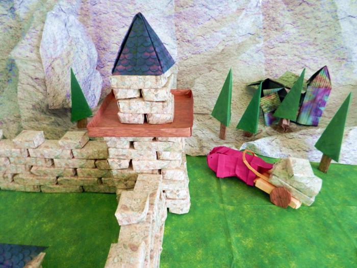 Pig walking at a large papercraft castle