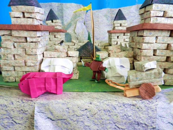 origami zombie and a pig at a large castle