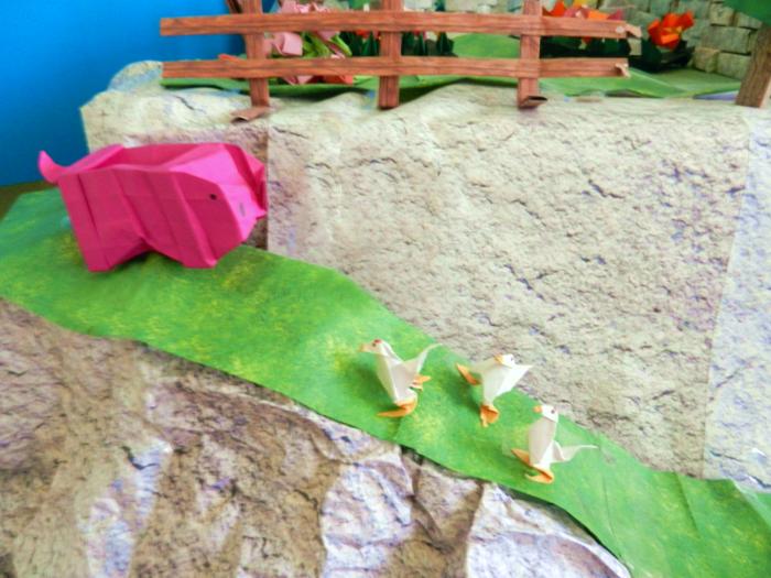 animals on a papercraft mountain path