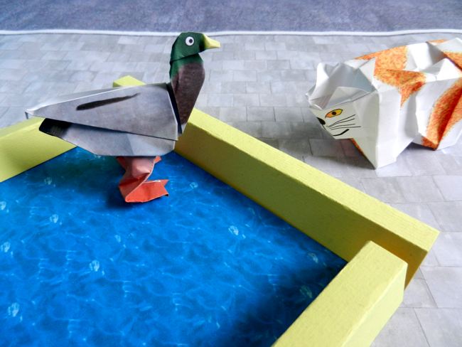 origami duck in a kirigami pool