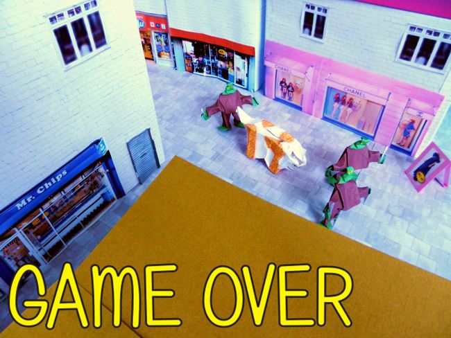 origami zombies and a cat hold captive