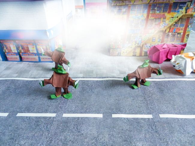 origami zombies running away from a smoke bomb